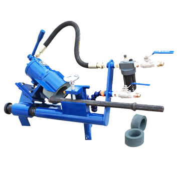 Chisel bit integral drill rod grinder